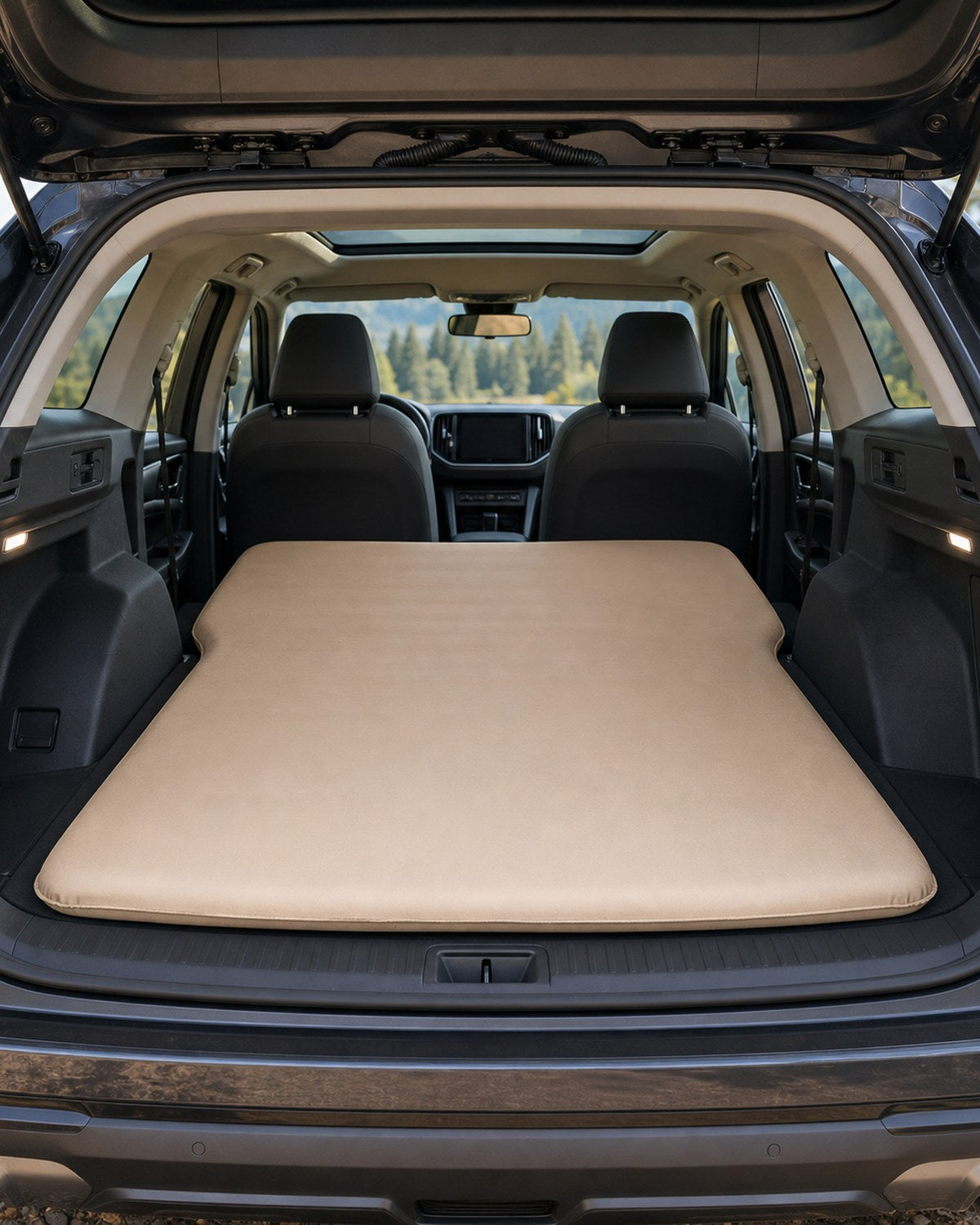 Vehicle sleeping mattress inside a folded cargo area