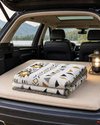 Camp blanket on SUV vehicle mattress